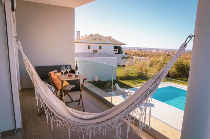 Balcony with hammock and pool below