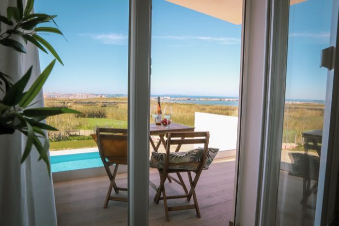 View from inside to the balcony and ocean