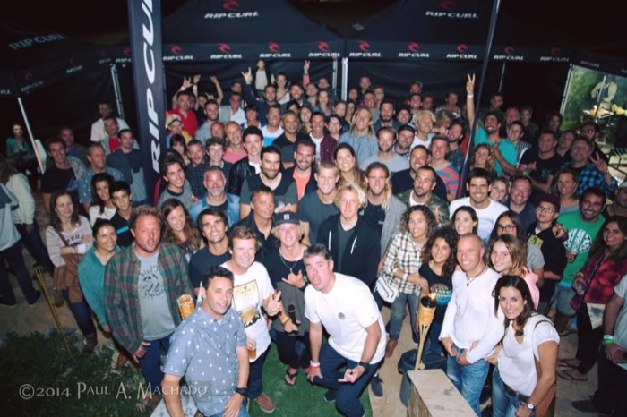 A crowd of surfers and locals packed under Rip Curl tents at night outside the restaurant.